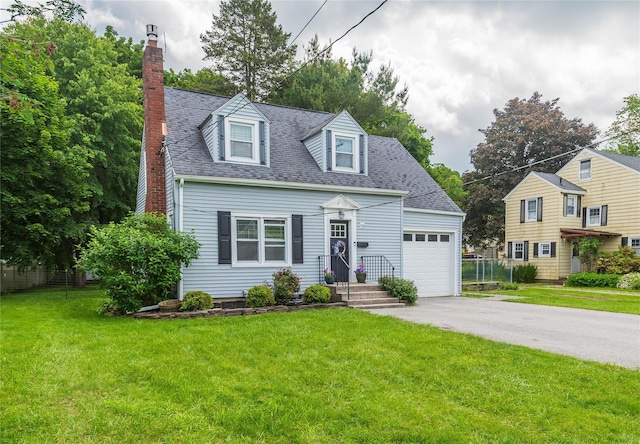 129 S St, Warwick, NY 10990 - cape cod-style house featuring a chimney, a garage, driveway, and a shingled roof