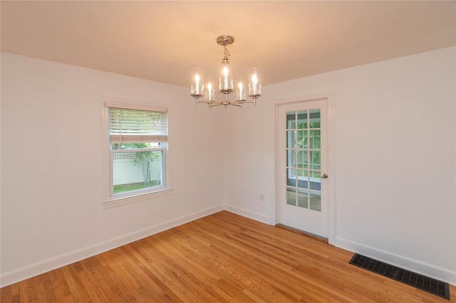 129 S St, Warwick, NY 10990 - unfurnished room featuring a chandelier, baseboards, and light wood finished floors
