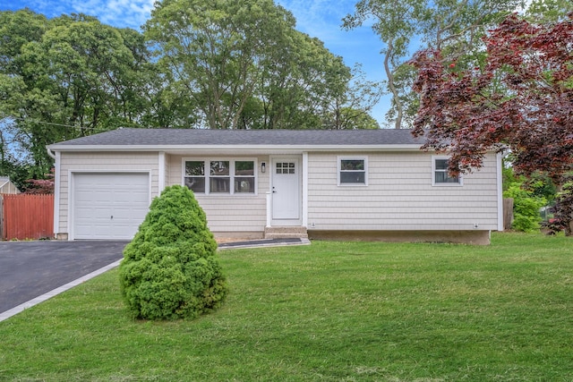 71 Selden Blvd, Centereach, NY 11720 - ranch-style home with driveway, an attached garage, and roof with shingles