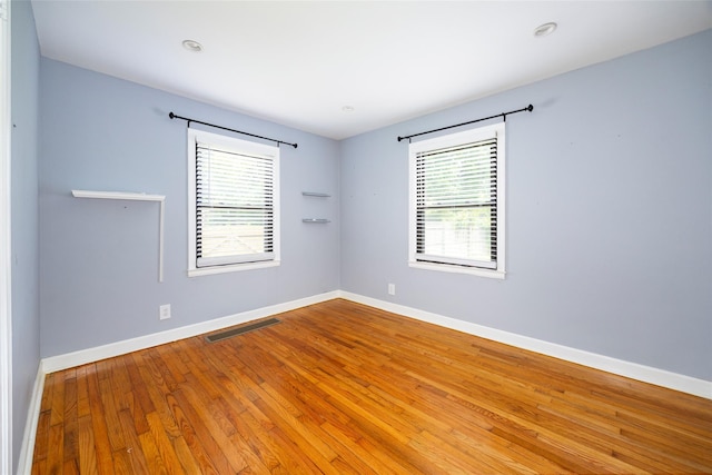 924 Violet Ave, Hyde Park, NY 12538 - spare room featuring plenty of natural light, wood-type flooring, and baseboards
