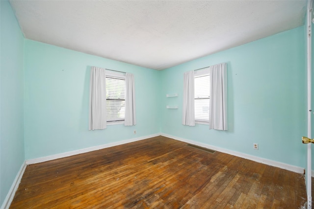 924 Violet Ave, Hyde Park, NY 12538 - spare room with plenty of natural light, dark wood-style flooring, and baseboards