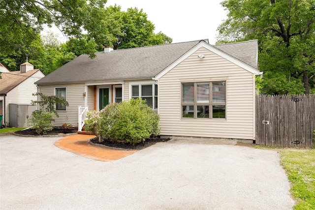 924 Violet Ave, Hyde Park, NY 12538 - view of front of house featuring roof with shingles, a chimney, and a patio