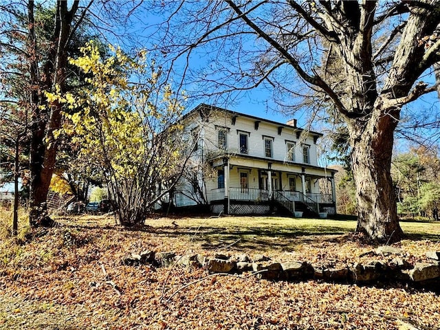 255 Howells Rd, Middletown, NY 10940 - italianate-style house with covered porch and a chimney