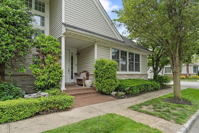 161 Harbor View Dr, Port Washington, NY 11050 - view of exterior entry with stone siding