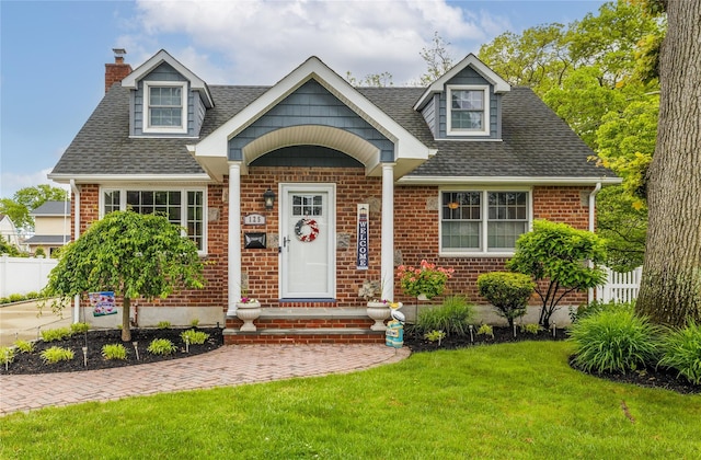 125 Frederick, Merrick, NY 11566 - view of front of property with a chimney, roof with shingles, and brick siding