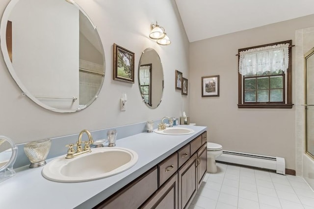 6295 N Country Rd, Wading River, NY 11792 - bathroom featuring a baseboard heating unit, vaulted ceiling, double vanity, and tile patterned floors