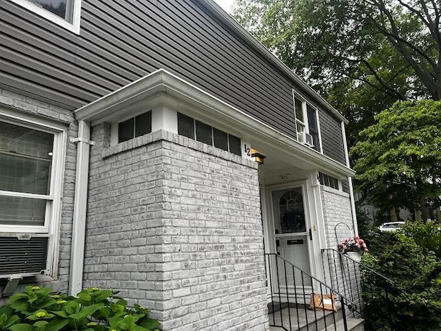 10 Glen Keith Rd Unit U, Glen Cove, NY 11542 - view of side of home with brick siding
