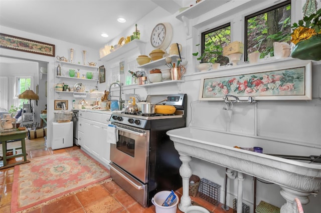 83 Tennanah Lake Rd, Roscoe, NY 12776 - kitchen with stainless steel gas range oven, open shelves, recessed lighting, white cabinetry, and light countertops