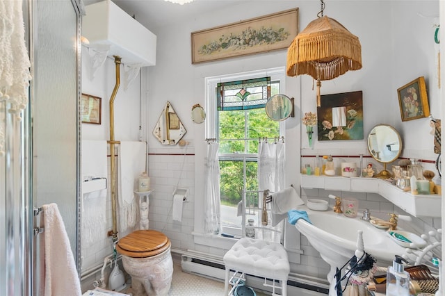 83 Tennanah Lake Rd, Roscoe, NY 12776 - bathroom featuring tile walls and wainscoting