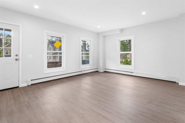 8 Chestnut St, Middletown, NY 10940 - spare room with a baseboard radiator, wood finished floors, recessed lighting, and baseboards