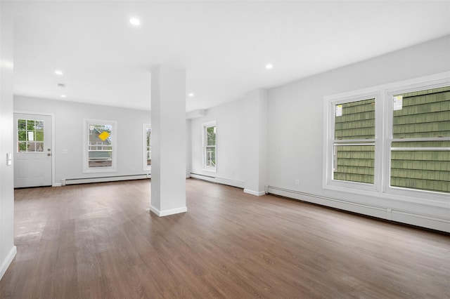 8 Chestnut St, Middletown, NY 10940 - unfurnished living room featuring baseboard heating, wood finished floors, recessed lighting, and baseboards