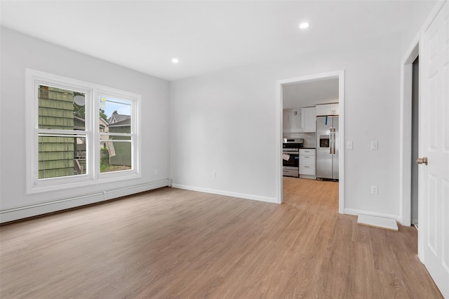 8 Chestnut St, Middletown, NY 10940 - empty room featuring a baseboard radiator, light wood-style floors, recessed lighting, and baseboards
