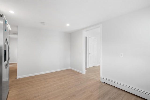 8 Chestnut St, Middletown, NY 10940 - spare room with a baseboard radiator, light wood-style flooring, recessed lighting, and baseboards