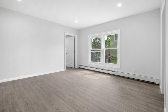 8 Chestnut St, Middletown, NY 10940 - unfurnished room with a baseboard radiator, wood finished floors, recessed lighting, and baseboards