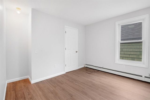 8 Chestnut St, Middletown, NY 10940 - empty room with baseboard heating, wood finished floors, and baseboards