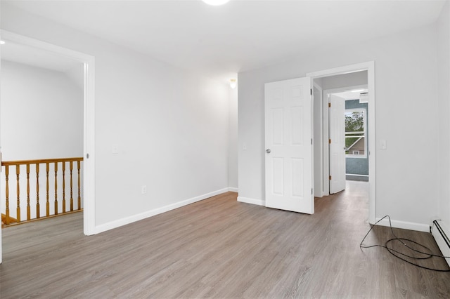 8 Chestnut St, Middletown, NY 10940 - spare room with light wood-style floors and baseboards