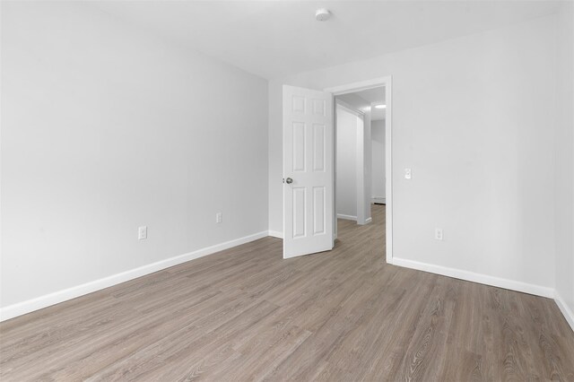 8 Chestnut St, Middletown, NY 10940 - unfurnished room featuring wood finished floors, baseboards, and a smoke detector