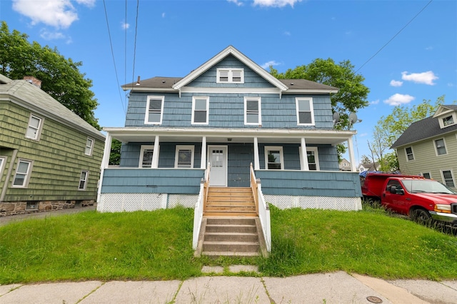 8 Chestnut St, Middletown, NY 10940 - traditional style home featuring a porch, a front yard, and stairway