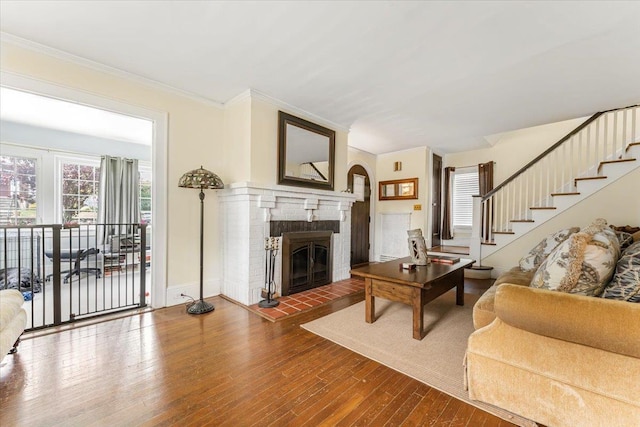 21 Chester Pl, New Rochelle, NY 10801 - living area with a fireplace, wood finished floors, crown molding, stairs, and baseboards