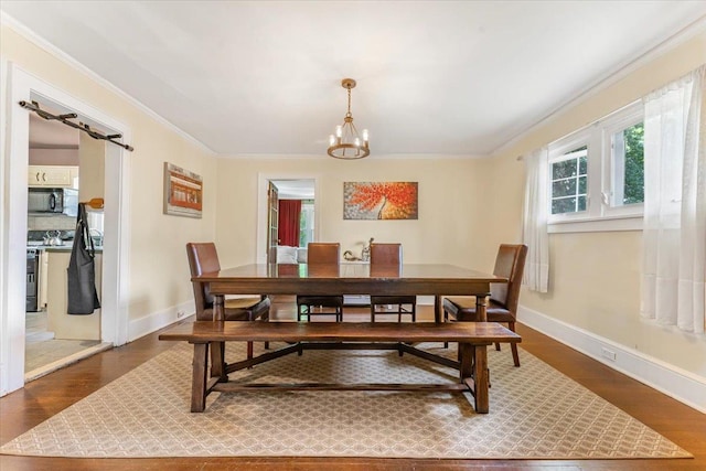 21 Chester Pl, New Rochelle, NY 10801 - dining room featuring crown molding, a chandelier, wood finished floors, and baseboards
