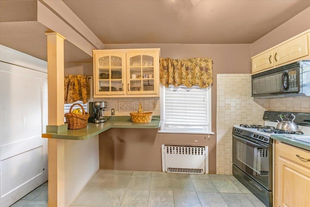 21 Chester Pl, New Rochelle, NY 10801 - kitchen featuring radiator, black appliances, light brown cabinets, glass insert cabinets, and backsplash