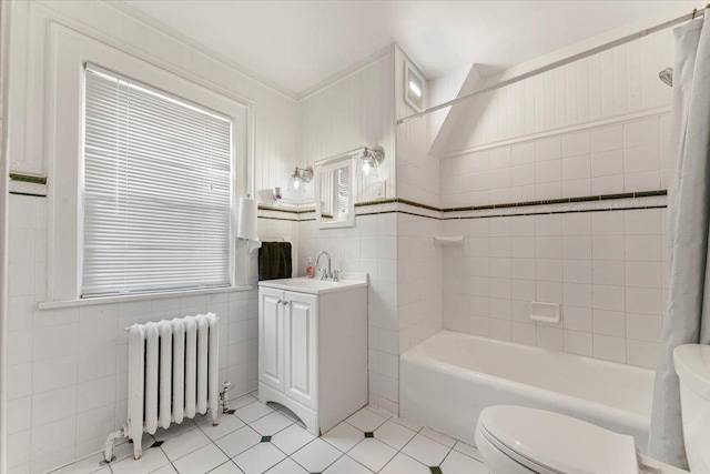 21 Chester Pl, New Rochelle, NY 10801 - bathroom with radiator heating unit, tile walls, toilet, tile patterned floors, and vanity