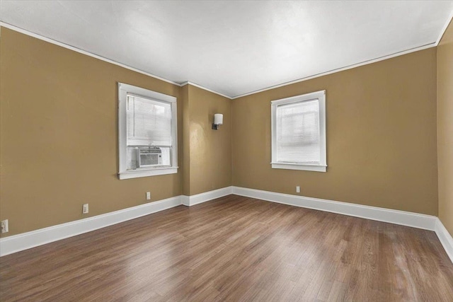 21 Chester Pl, New Rochelle, NY 10801 - unfurnished room featuring wood finished floors, plenty of natural light, baseboards, ornamental molding, and cooling unit