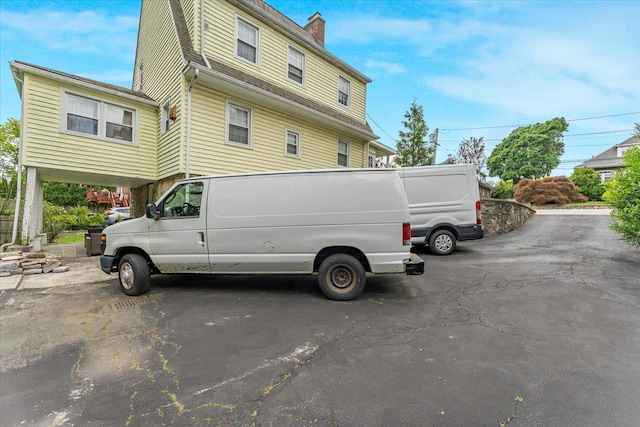 21 Chester Pl, New Rochelle, NY 10801 - view of home's exterior with a chimney
