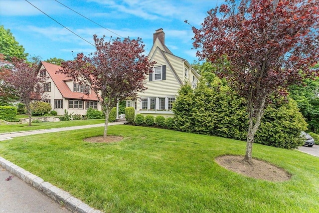 21 Chester Pl, New Rochelle, NY 10801 - view of front facade with a front lawn and a chimney