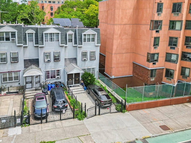 977 E 179th St, Bronx, NY 10460 - view of building exterior with a fenced front yard