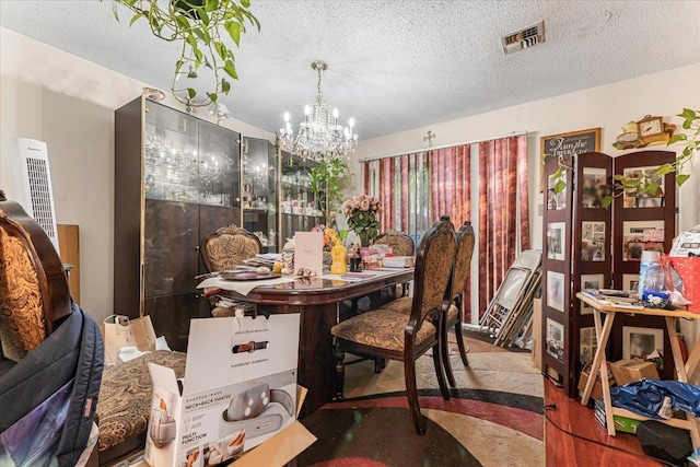 977 E 179th St, Bronx, NY 10460 - dining space featuring a chandelier and a textured ceiling