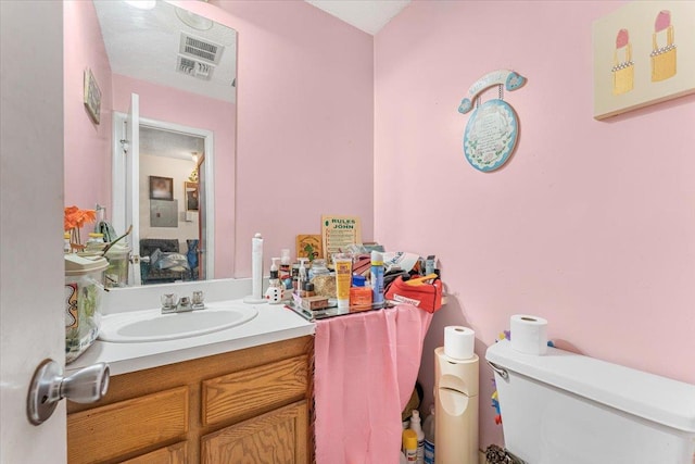 977 E 179th St, Bronx, NY 10460 - bathroom featuring toilet and vanity