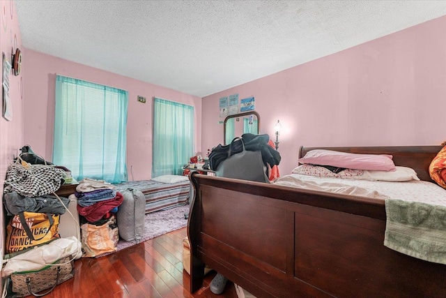 977 E 179th St, Bronx, NY 10460 - bedroom with hardwood / wood-style flooring and a textured ceiling