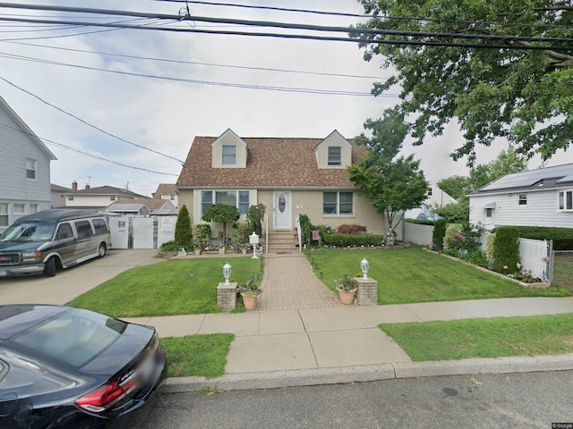 128 Hunnewell Ave, Elmont, NY 11003 - cape cod house featuring a gate, driveway, brick siding, and roof with shingles