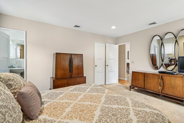 904 Woodmere Dr, North Woodmere, NY 11581 - bedroom with recessed lighting, light colored carpet, and a sink