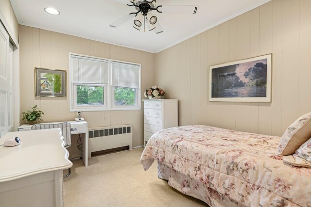 904 Woodmere Dr, North Woodmere, NY 11581 - bedroom featuring radiator heating unit, light colored carpet, ornamental molding, and ceiling fan