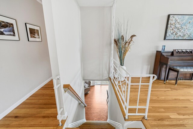904 Woodmere Dr, North Woodmere, NY 11581 - stairway featuring wood finished floors and baseboards