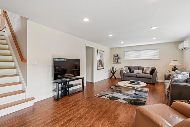904 Woodmere Dr, North Woodmere, NY 11581 - living area with a wall mounted air conditioner, stairs, wood finished floors, and recessed lighting