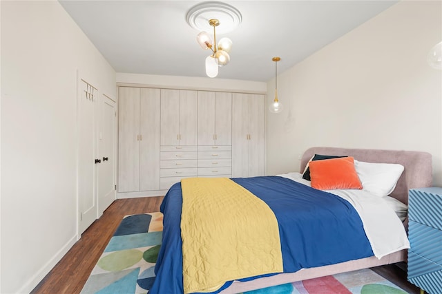 73-20 Austin St Unit 6K, Forest Hills, NY 11375 - bedroom featuring wood finished floors, a closet, and baseboards