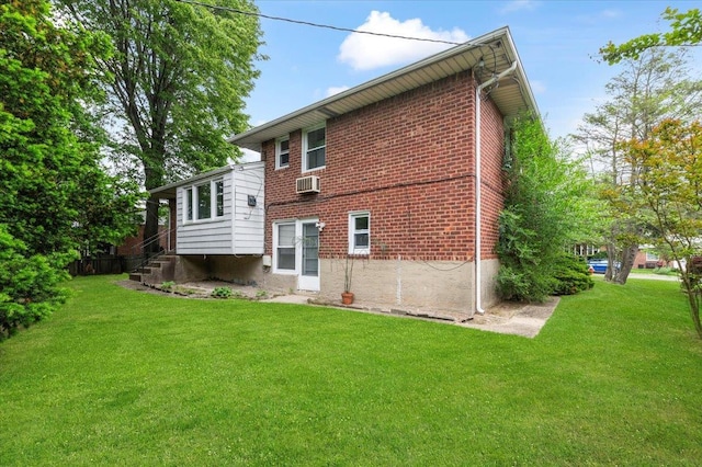 18 Overlook Ln, Plainview, NY 11803 - back of house with a yard, brick siding, and cooling unit
