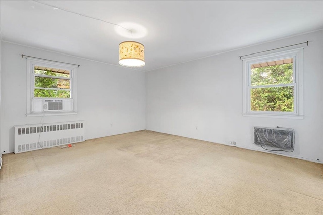 18 Overlook Ln, Plainview, NY 11803 - carpeted spare room with radiator and a wall unit AC