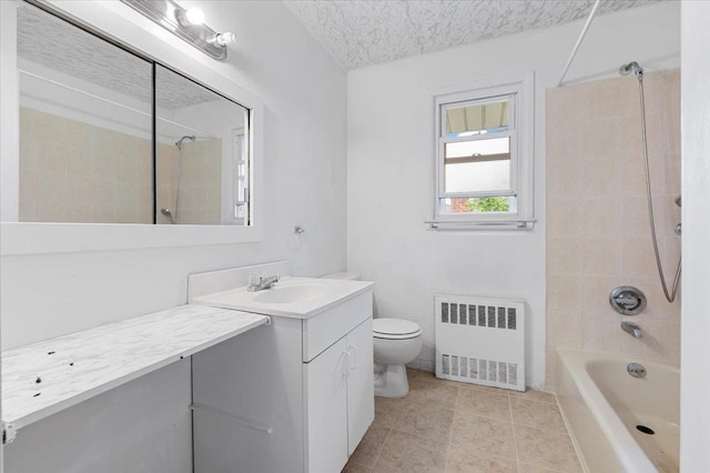 18 Overlook Ln, Plainview, NY 11803 - full bath with radiator heating unit, vanity, toilet, tub / shower combination, and tile patterned floors
