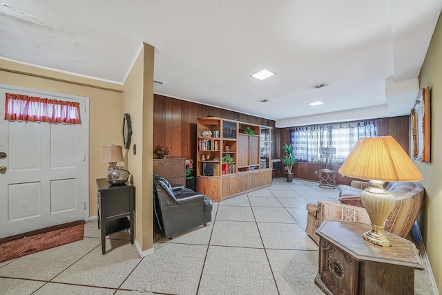 47-04 167th St, Flushing, NY 11358 - living area featuring wood walls, baseboards, and light tile patterned flooring