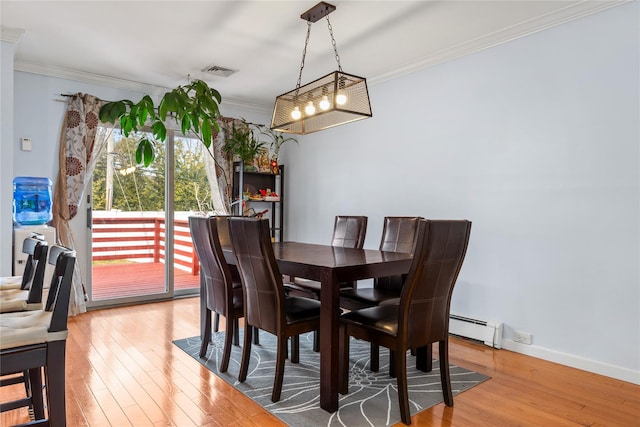 30 Eaton Rd, Syosset, NY 11791 - dining space featuring ornamental molding, light wood-style floors, a baseboard heating unit, and baseboards