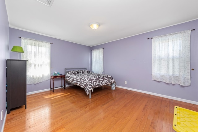 30 Eaton Rd, Syosset, NY 11791 - bedroom with hardwood / wood-style floors, baseboards, and crown molding