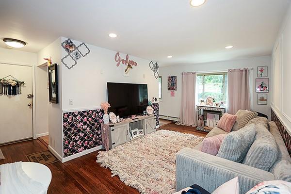 2449 Union Blvd Unit 24A, Islip, NY 11751 - living room featuring a baseboard radiator, wood finished floors, and recessed lighting