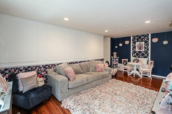 2449 Union Blvd Unit 24A, Islip, NY 11751 - living area with dark wood finished floors, recessed lighting, and a decorative wall