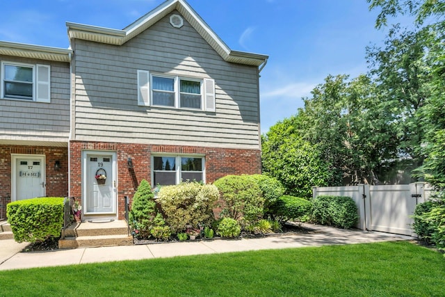 1425 Jerusalem Ave Unit 19, North Merrick, NY 11566 - townhome / multi-family property featuring brick siding and a gate