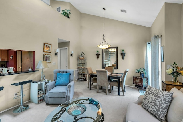 1425 Jerusalem Ave Unit 19, North Merrick, NY 11566 - living area featuring light carpet, high vaulted ceiling, and baseboards