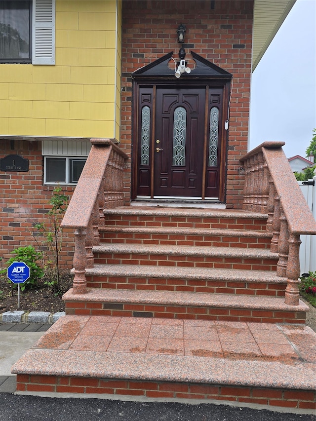 1 Terry Ln, Jericho, NY 11753 - view of exterior entry featuring brick siding